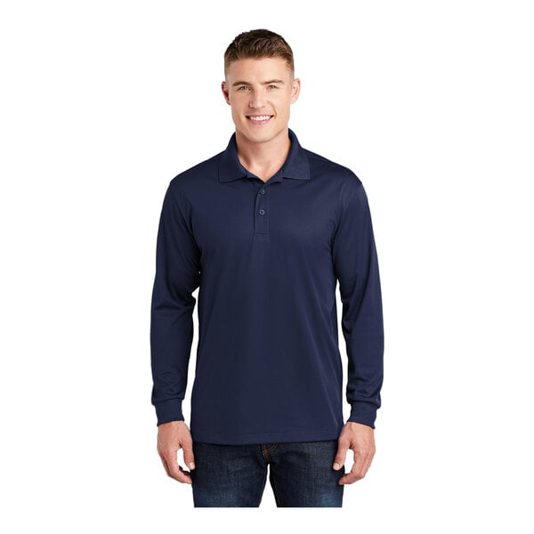 A man wearing a navy blue Sport-Tek long sleeve polo shirt.