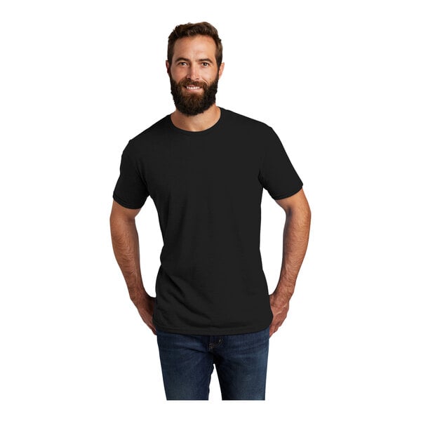 A man with a beard wearing a black AllMade T-shirt.