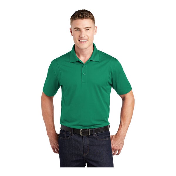 A man wearing a kelly green Sport-Tek polo shirt.