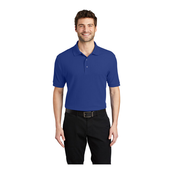 A man wearing a Port Authority® royal blue silk touch polo shirt.