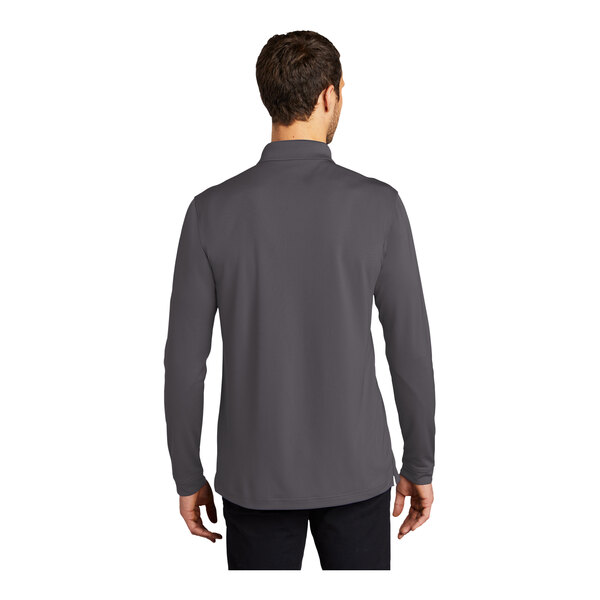 A man wearing a graphite Port Authority long sleeve polo shirt.