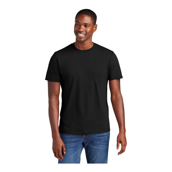 A man wearing a black District® short sleeve T-shirt.
