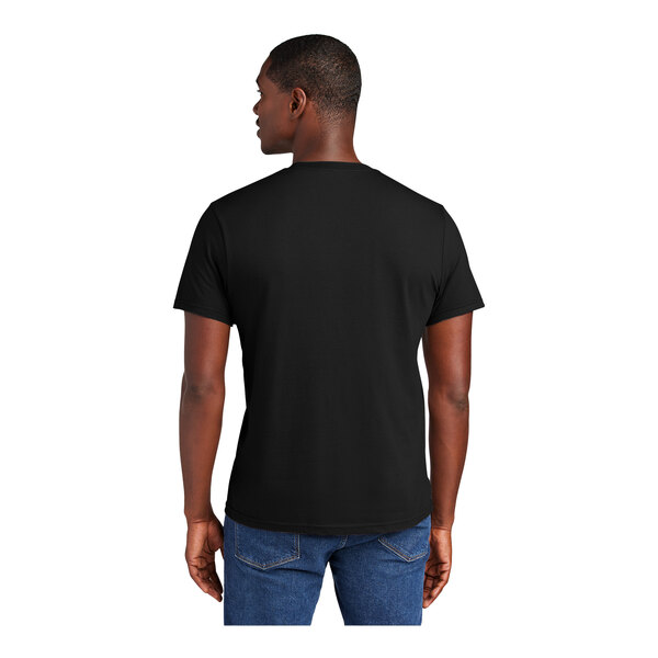 A man wearing a black District black t-shirt.
