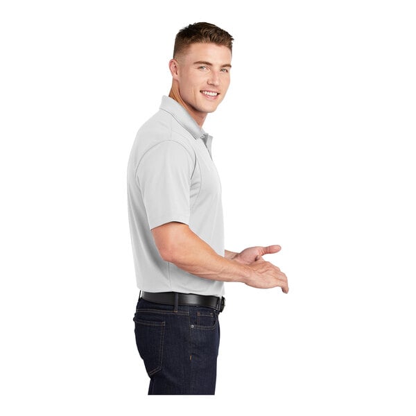 A man in a white Sport-Tek short sleeve polo shirt.