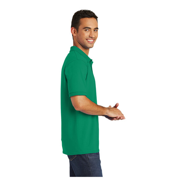 A man wearing a Port & Company Kelly green short sleeve polo.