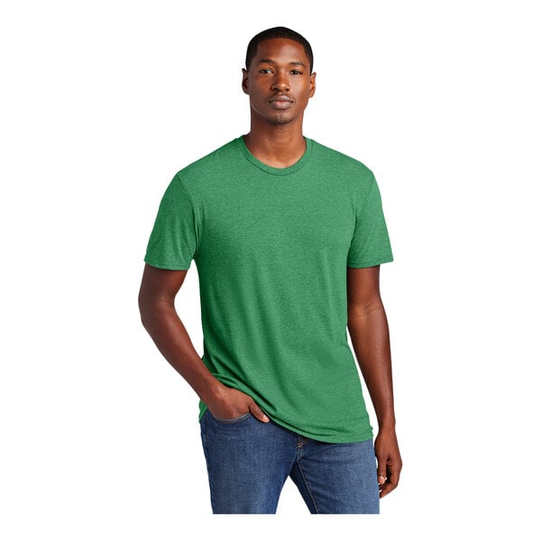 A man wearing a heathered kelly green District T-shirt.