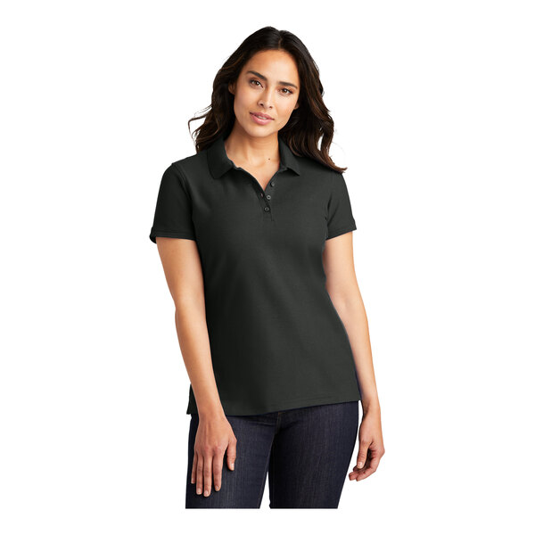 A woman wearing a black Port Authority Pique Polo shirt.