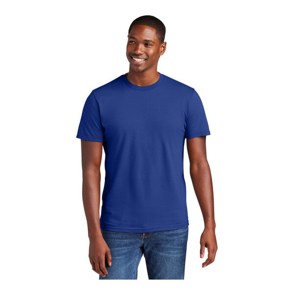 A man wearing a District® deep royal blue short sleeve t-shirt.