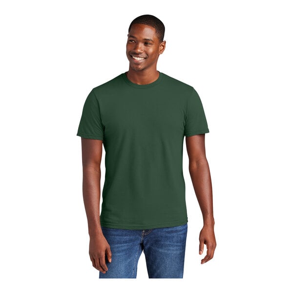 A man wearing a District® forest green short sleeve t-shirt.