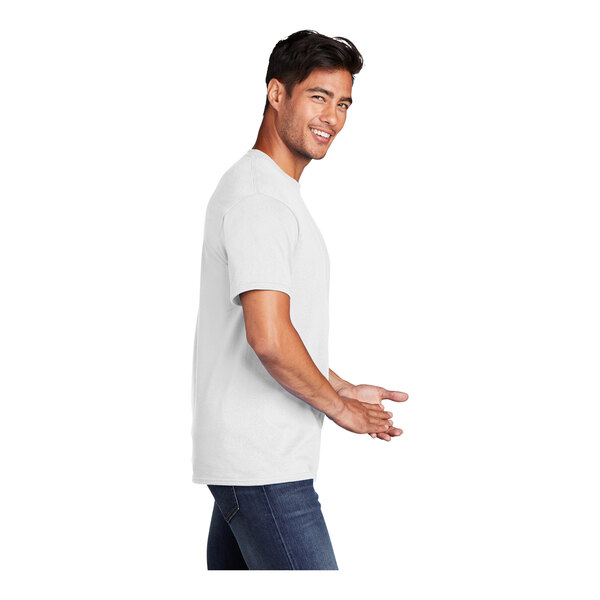 A man wearing a white Port & Company short sleeve t-shirt smiling.