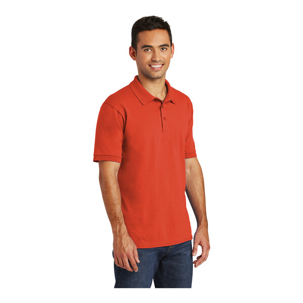 A man wearing an orange Port & Company polo shirt.