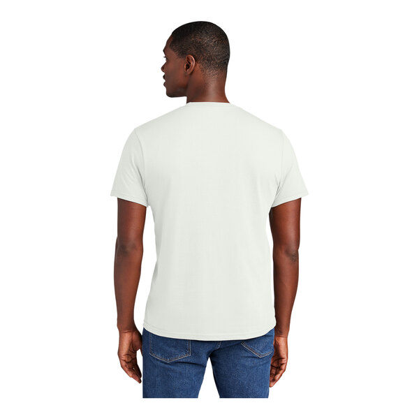 A man wearing a District white short sleeve t-shirt.