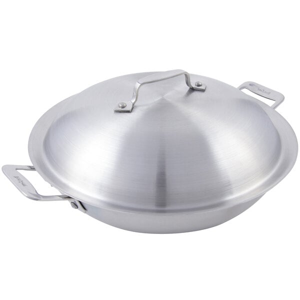 A silver stainless steel Bon Chef chef's pan with lid and side handles.