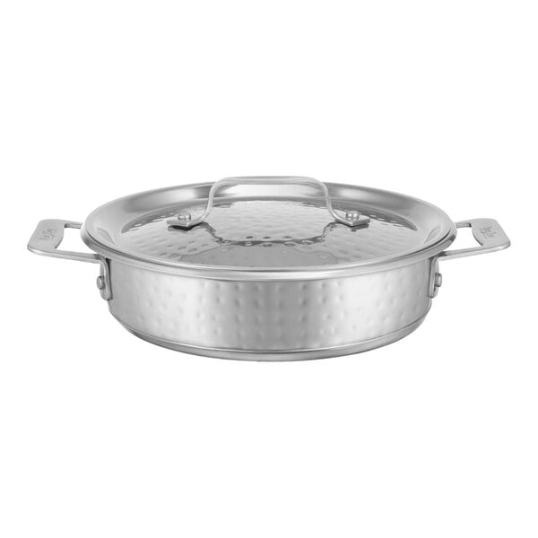 A silver stainless steel Bon Chef round casserole with a hammered finish and lid.