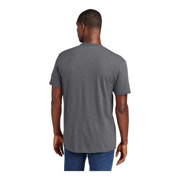 A man wearing a heathered grey District t-shirt.