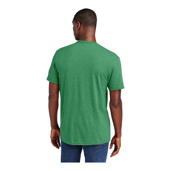 A man wearing a heathered green District T-shirt.