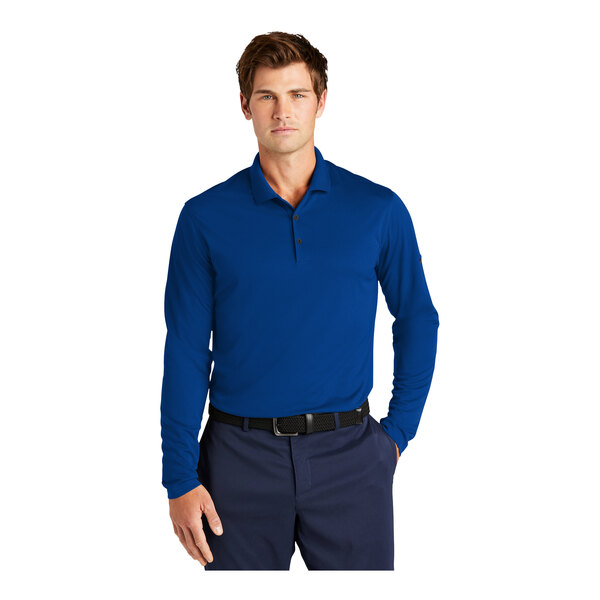 A man wearing a blue Nike short sleeve polo.