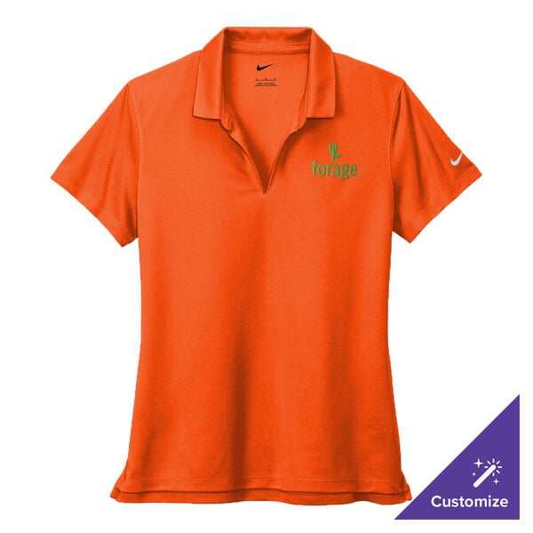 A Nike women's orange Dri-FIT polo shirt with a logo on it.