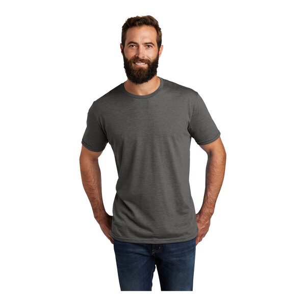 A man with a beard wearing a space black AllMade T-shirt.