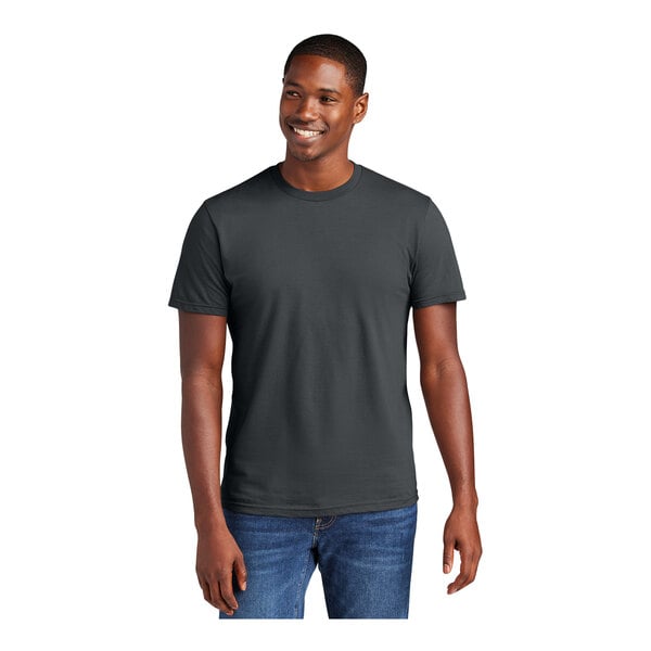 A man wearing a District unisex charcoal short sleeve t-shirt.