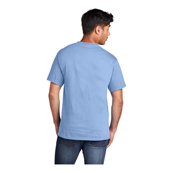 A man wearing a light blue Port & Company T-shirt.