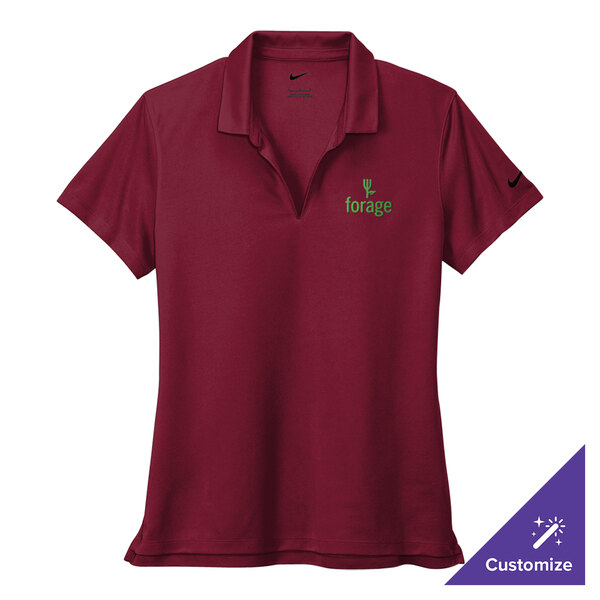 A women's red Nike polo shirt with green embroidery on the chest.