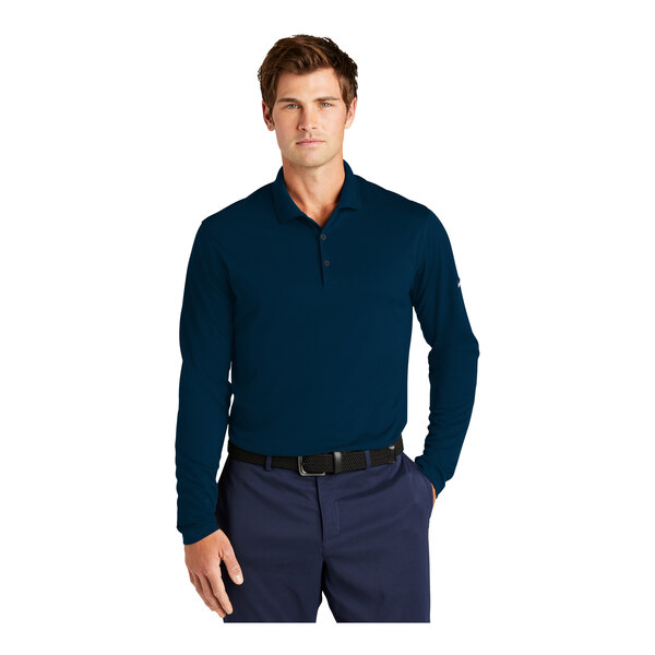 A man wearing a navy blue Nike short sleeve polo shirt.