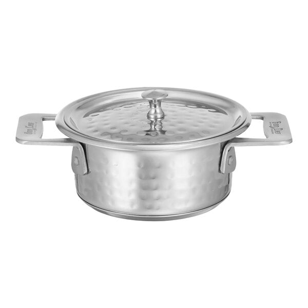 A Bon Chef stainless steel round side dish with a hammered finish and lid.