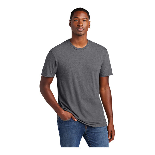 A man wearing a District heathered charcoal T-shirt.