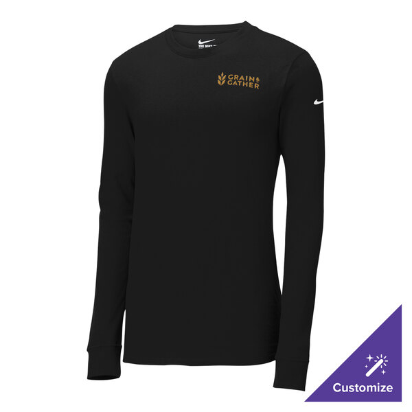 A black Nike long sleeve shirt with a gold logo on the counter.
