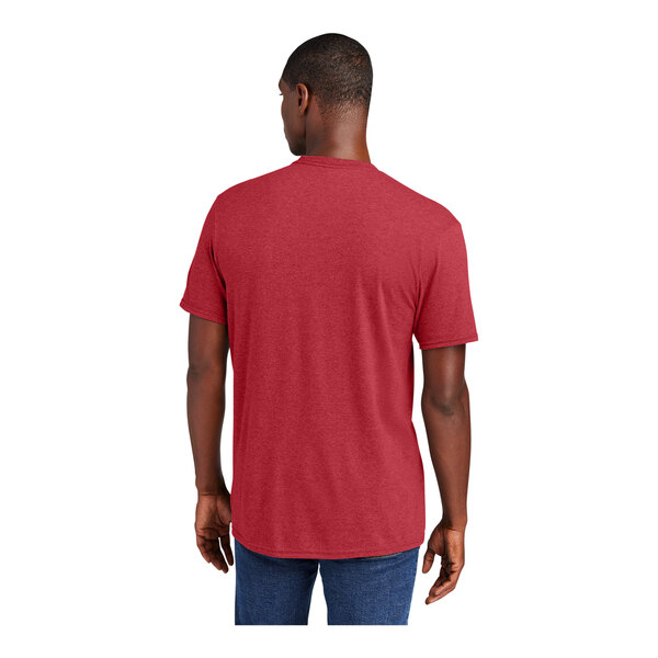 A man wearing a District heathered red short sleeve t-shirt.