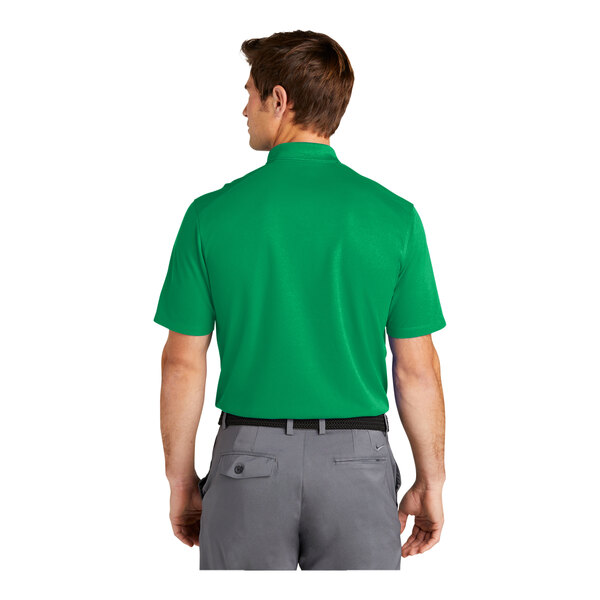 A man wearing a green Nike polo shirt.