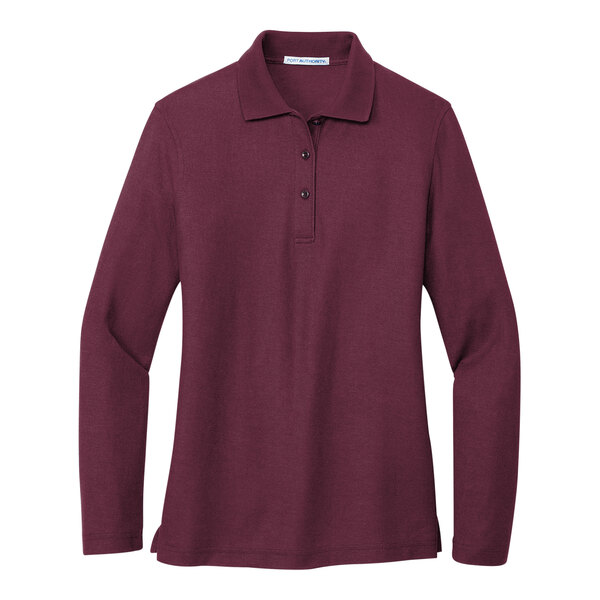 A Port Authority burgundy long sleeve polo shirt for women.