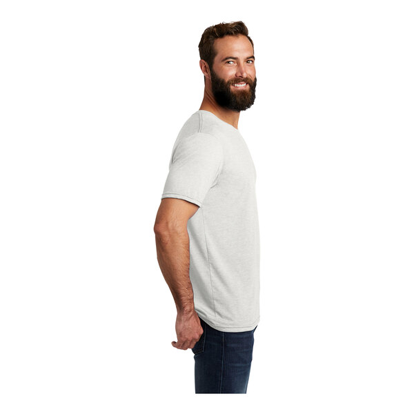 A man with a beard wearing a white AllMade tri-blend t-shirt.