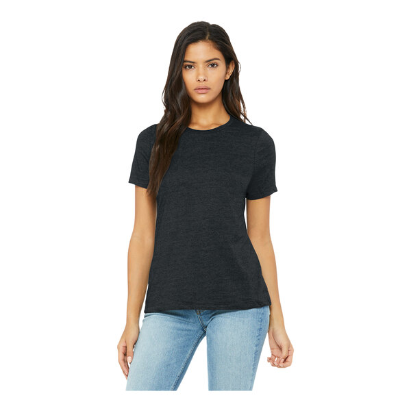 A woman wearing a dark gray heather Bella + Canvas combed ring-spun cotton/poly blend t-shirt.