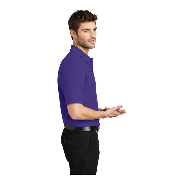 A man wearing a Port Authority purple silk touch polo.