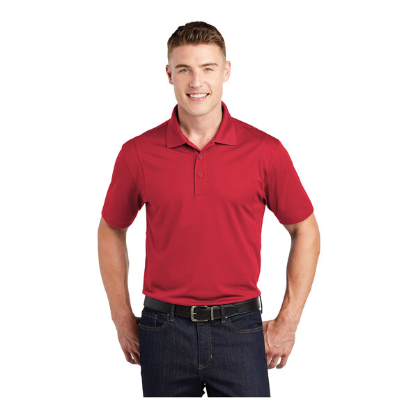 A man wearing a red Sport-Tek short sleeve polo.