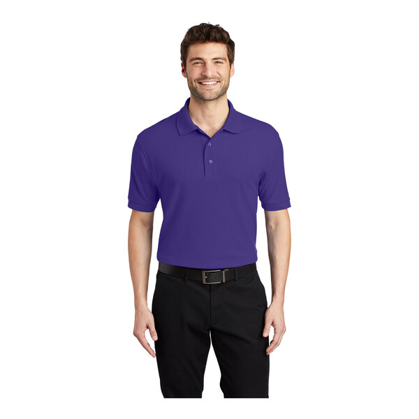 A man wearing a purple Port Authority® silk touch polo shirt.