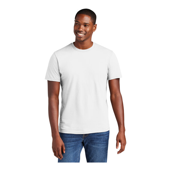 A man wearing a white District t-shirt.