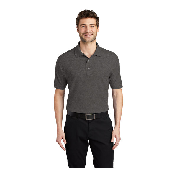A man wearing a Port Authority charcoal heather grey polo shirt.