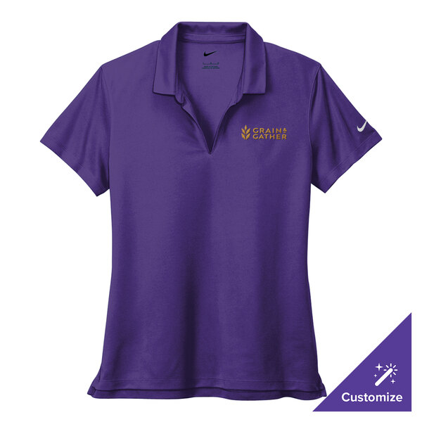 A Nike Court Purple women's performance polo shirt with a logo on it.