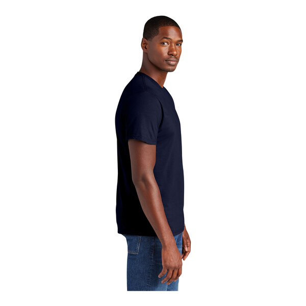 A man wearing a District New Navy short sleeve t-shirt.