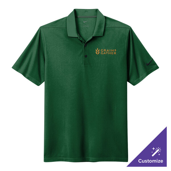 A Nike Gorge Green polo shirt with a logo on it.