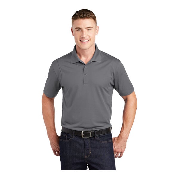 A man wearing a gray Sport-Tek moisture-wicking polo shirt.