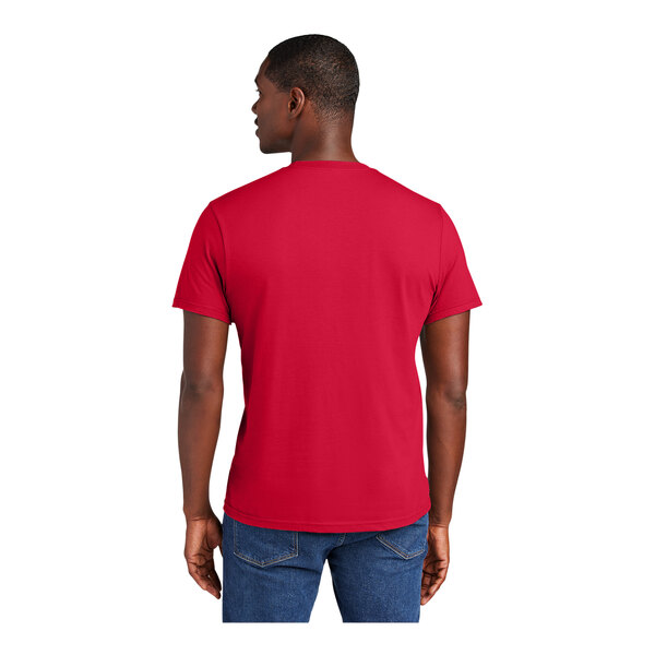 A man wearing a District Classic Red short sleeve t-shirt.
