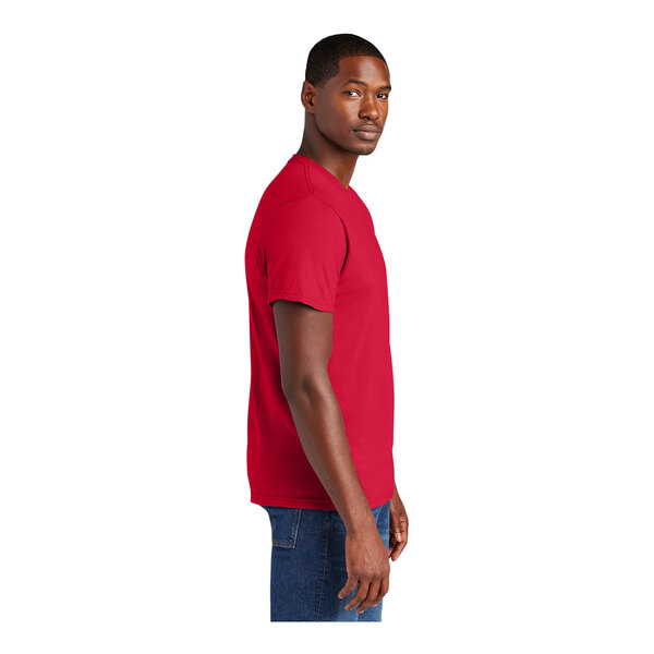 A person wearing a classic red District T-shirt.