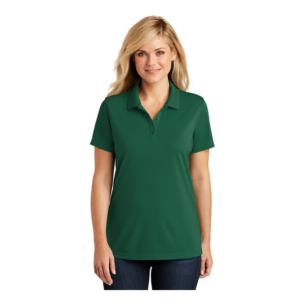 A woman wearing a Port Authority Deep Forest Green polo shirt.