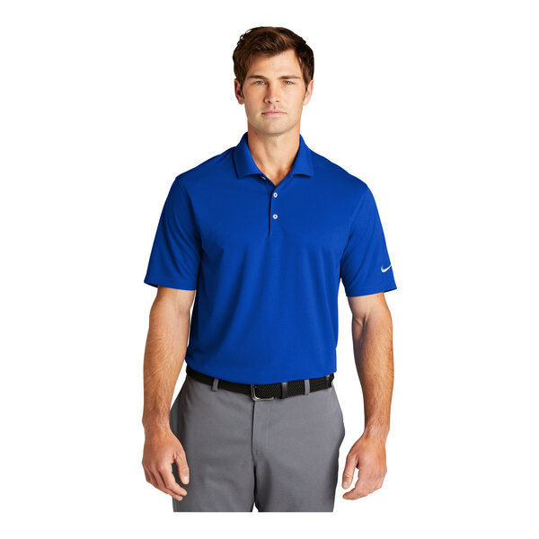 A man wearing a Nike Dri-Fit blue polo shirt.
