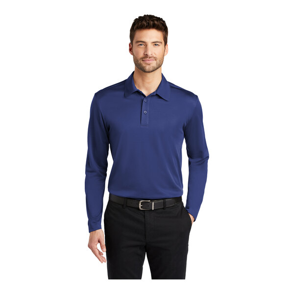 A man wearing a blue Port Authority long sleeve polo shirt.