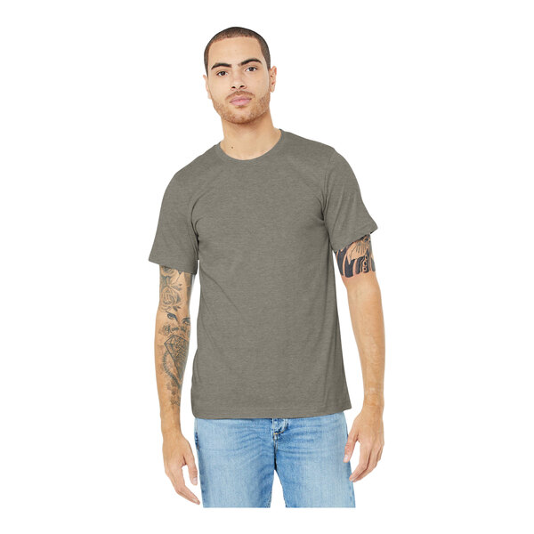 A man wearing a Bella + Canvas heather stone t-shirt.